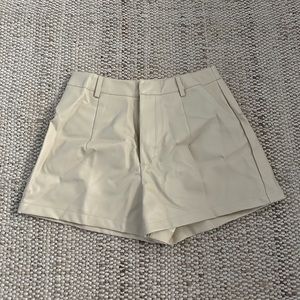 nastygal tan leather shorts with stars on back